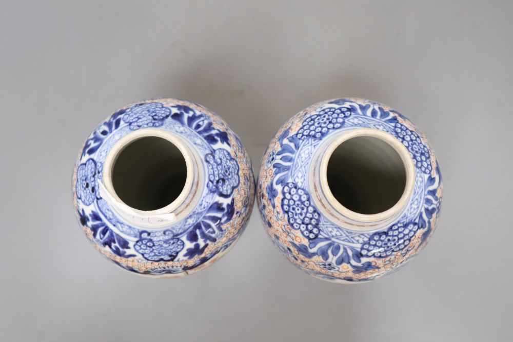 A pair of 18th century Chinese famille rose figural vases, height 25.5cm